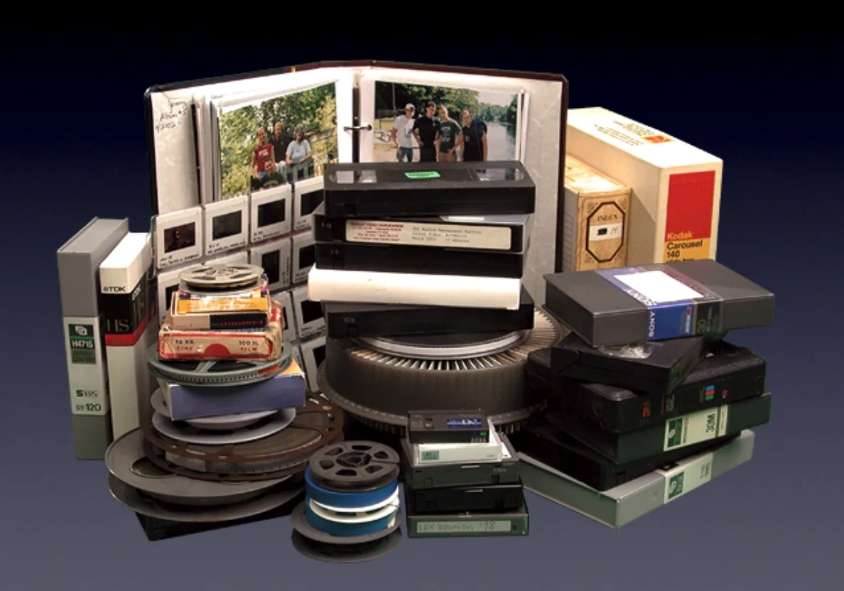 Videotapes, film reels, slides and photo albums awaiting transfer