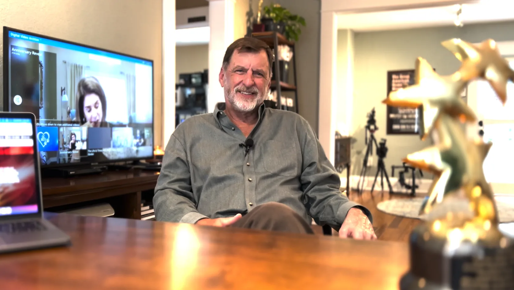 A studio owner reviewing a client&rsquo;s Digital Video Archive at home